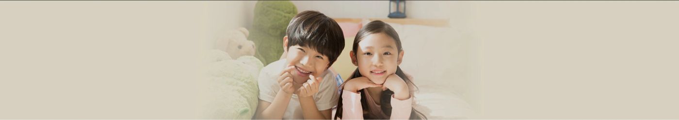 Smiling children enjoying a sweet moment